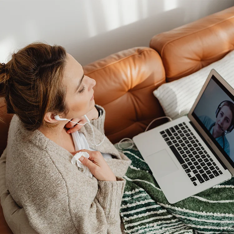Patient connecting with a healthcare professional through a secure video conferencing platform.